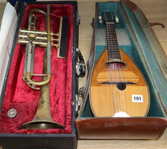 A mandolin and a cased Besson trumpet